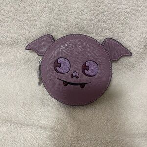 Purple Coach bat coin purse